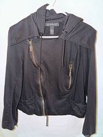 Front view showing asymmetrical zipper, chest pocket, hood