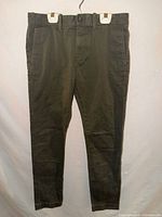 Full frontal view of olive green J.Crew slim khakis