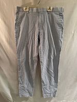 Front view of blue & white striped seersucker pants hanging