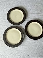 Three Threshold plates displayed front side