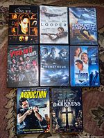 All eight DVD cases laid out to show cover titles