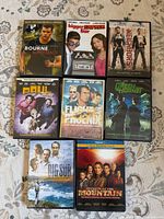 Front covers of eight DVD cases laid out in two rows