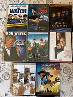 All eight DVD cases laid out front covers visible