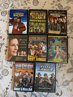 All eight DVD cases front covers visible