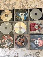 All nine DVDs laid out 3×3 in clear cases