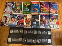 All 13 boxed VHS cassettes and 8 loose tapes laid out