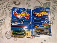 Front of two sealed Hot Wheels cars showing models and packaging