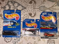 Front view of all three Hot Wheels cars carded