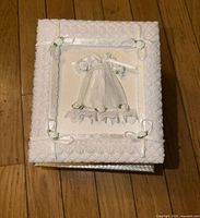 Closed album showing satin lace and ribbon detail