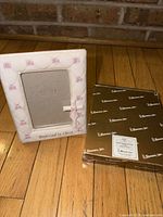 Front view of frame and box showing design, size and condition