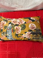 Front view of pillow showing full Asian motif print