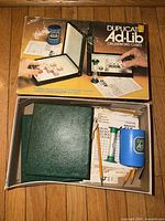 boxed game with lid displaying title and components