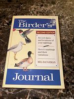 Front cover showing title, edition, author and bird illustrations