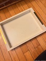 Top view of entire tray showing cream color and gold accent handles