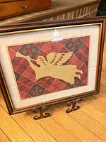 Framed laser-cut angel wall art on stand, front view