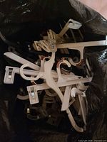 Top view of contractor bag showing numerous plastic hangers