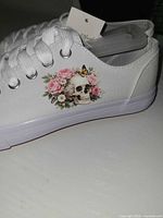 Side view showing skull and floral graphic and canvas material