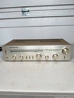 Full front view of Marantz SR220 receiver showing all controls and faceplate