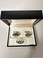 Open case showing both cufflinks and presentation box