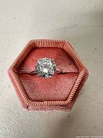 Front view showing round CZ and prong setting