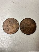 Front view of both coins side by side