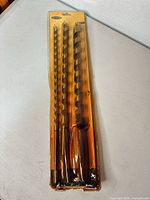 Front view of sealed pack showing three auger bits