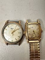 Front view of both Wyler and Bulova watches showing dials and cases