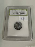 Front of INB slab showing coin and label