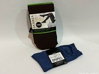 Front view of brown tights package and folded blue tights