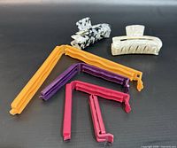 All items laid out: two hair claw clips, six sealing clips