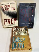 Front covers of the three paperback books