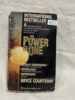 Front cover showing title, author, bestseller text, price sticker