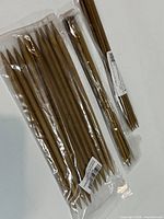 Three sealed packs of bamboo double-pointed knitting needles