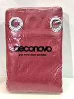 Front view of packaged red Deconovo curtain panel with grommets visible