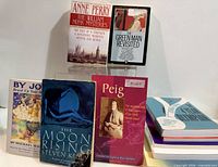 Group shot showing By Jove!, The Moon Rising, Peig, The William Monk Mysteries, The Green Man Revisited and additional stacked volumes