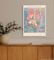 Full view of framed poster hung on wall