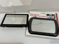 Both visor mirrors side by side, one packaged, one loose