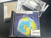 Front covers of three CDs including Yes, Laurie Anderson, Electric Counterpoint