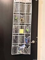 Organizer hanging on door showing full 15-pocket layout