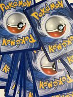 Stack of card backs with Pokémon logo and Poké Ball design