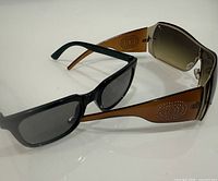 Both pairs of sunglasses side by side showing overall styles
