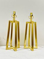 Front view showing both matching open frame brass lamps