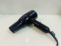 Left side view showing overall shape, nozzle and handle