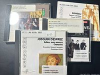 Front view of four CD cases showing cover art and titles