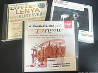 Front view of all three CD cases showing titles and library labels