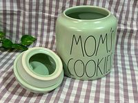 Jar and lid separated showing interior and lettering