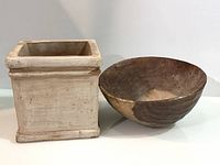 ceramic planter and wooden bowl front view