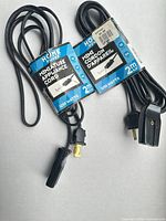 Two packaged appliance cords front view showing length and wattage