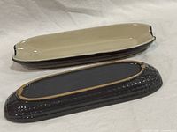 Top and bottom view of both ceramic corn dishes showing glaze colors and condition