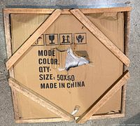 Front of boxed stone slab with size 50x50 marking and wood brace